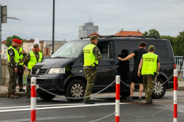 Polish border guards check a vehicle at Polish-German border, as Poland starts controls on borders with Germany, Lithuania over migration, near the German town of Frankfurt an der Oder, in Slubice, Poland, July 7, 2025. REUTERS/Lisi Niesner
