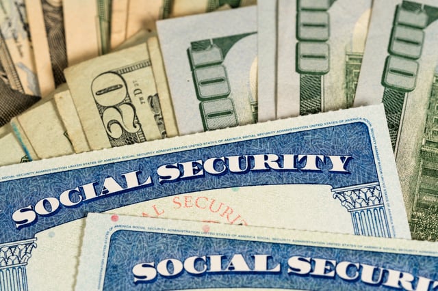Stock image/file photo: Social Security cards with U.S. Dollars.