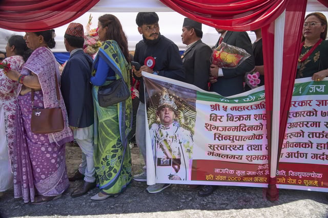 Pro-monarchy supporters line up to offer birthday wishes to former King Gyanendra Shah at his residence, in Kathmandu, Nepal, Monday, July 7, 2025. (AP Photo/Niranjan Shrestha)