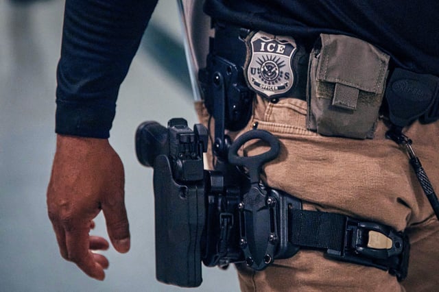 A Federal agent patrols during an immigration hearing inside the Jacob K. Javits Federal Building on June 11, 2025, in New York City.