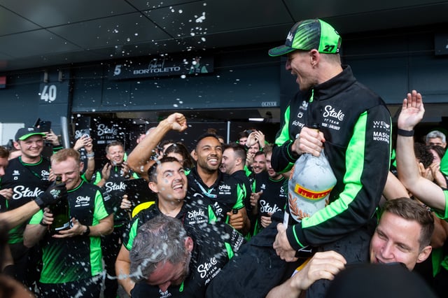 Nico Hulkenberg of Germany and Stake F1 Team Kick Sauber celebrates with his team after finishing on the podium for the first time during the F1 Grand Prix of Great Britain at Silverstone Circuit on July 6, 2025 in Northampton, United Kingdom.