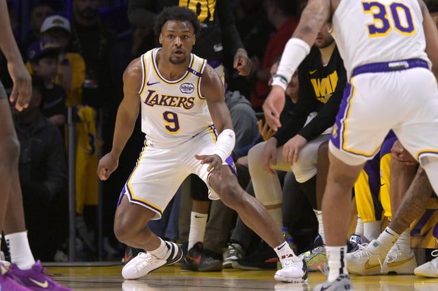Los Angeles Lakers guard Bronny James (9) defends on the court in the second half against the Minnesota Timberwolves at Crypto.com Arena in Los Angeles, California on April 19, 2025.
