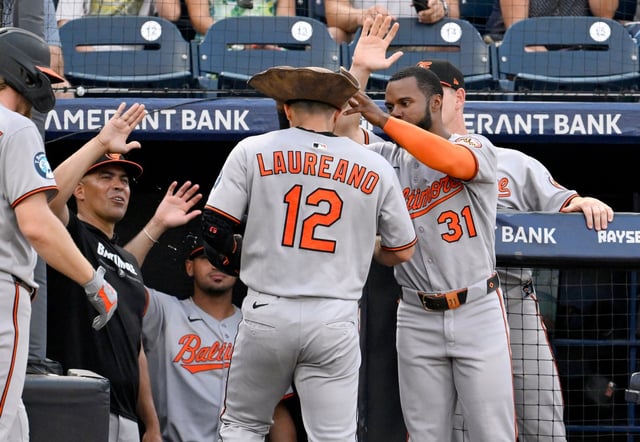 Baltimore Orioles&#39; Ramón Laureano (12) and Cedric Mullins (31) celebrate Laureano&#39;s three-run home run during the second inning of a baseball game against the Tampa Bay Rays, Wednesday, June 18, 2025, in Tampa, Fla. (AP Photo/Jason Behnken)