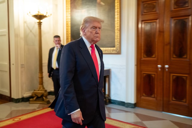 Trump walking through government building