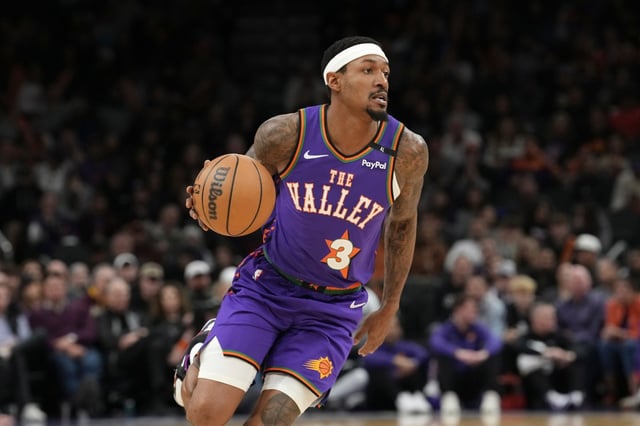 Phoenix Suns guard Bradley Beal dribbles the ball against the Charlotte Hornets during the second half of an NBA basketball game Sunday, Jan. 12, 2025, in Phoenix. The Suns won 120-113. (AP Photo/Ross D. Franklin)