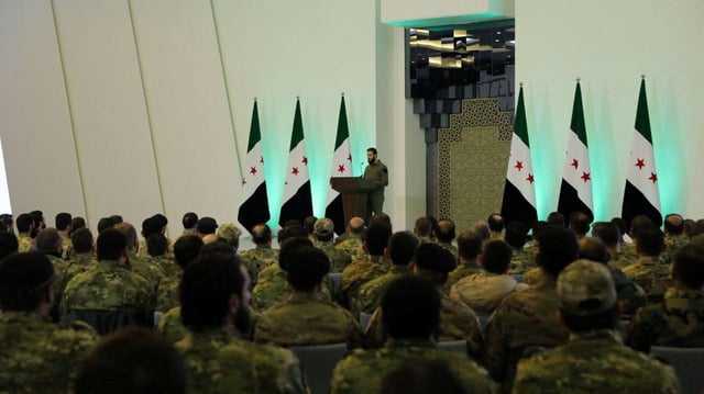 Syria's de facto leader Ahmed al-Sharaa talks during a meeting attended by commanders of armed groups that fought alongside Hayat Tahrir al-Sham to oust Bashar al-Assad from power, in Damascus, Syria, in this handout released on January 29, 2025. SANA/Handout via REUTERS/ File Photo