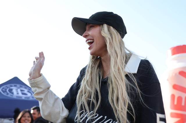 SAN JOSE, CALIFORNIA – MAY 17:  Alex Cooper, owner of Unwell Hydration gestures in the NWSL &amp; Unwell launch fan program Unwell FC prior to the NWSL match between Bay FC and Angel City FC at PayPal Park on May 17, 2025 in San Jose, California. (Photo by Kelley L. Cox/NWSL via Getty Images)