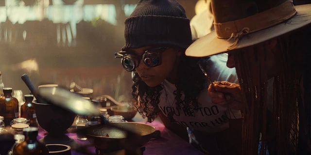 Zelma investigating something with goggles in Ironheart.