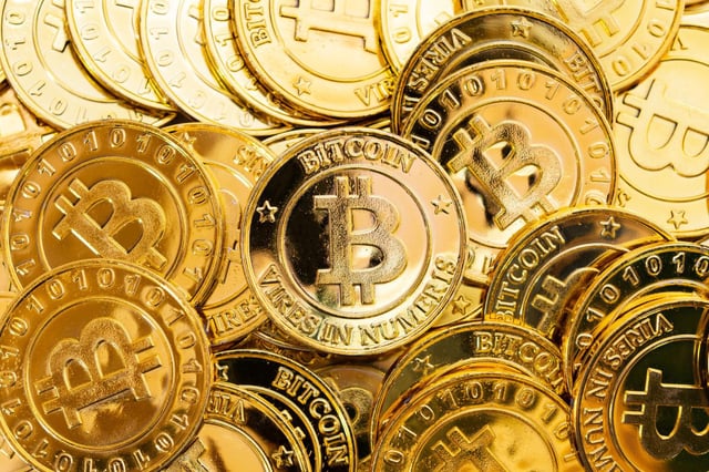 A file photo of golden Bitcoins, representing the digital currency.