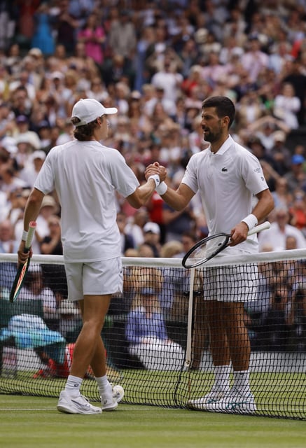 Tennis - Wimbledon - All England Lawn Tennis and Croquet Club, London, Britain - July 7, 2025 Serbia's Novak Djokovic shakes hands with Australia's Alex de Minaur after winning his round of 16 match REUTERS/Andrew Couldridge