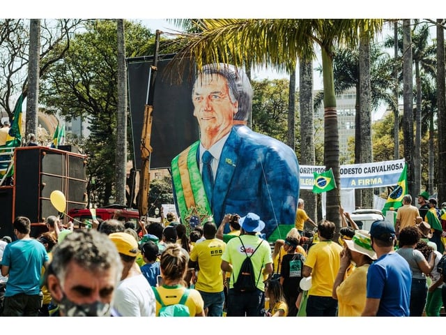 Supporters of former Brazilian president Jair Bolsonaro gather at Praça da Liberdade. While facing trial for allegations of staging a coup, Bolsonaro has maintained popularity and influence in the South American country. 