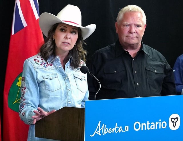Alberta Premier Danielle Smith speaks at press conference while Ontario Premier Doug Ford looks on. The premiers signed two MOU's to help strengthen interprovincial trade and build new energy infrastructure. Monday, July 7, 2025. 