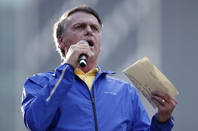 Former President Jair Bolsonaro speaks during a protest against his Supreme Court trial, in which he is accused of involvement in a 2022 coup attempt, in Sao Paulo, Sunday, June, 29, 2025. (AP Photo/Ettore Chiereguini)