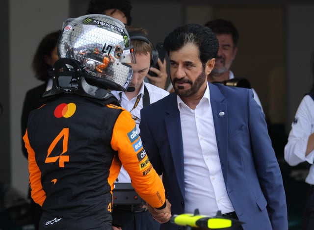 Formula One F1 - Miami Grand Prix - Miami International Autodrome, Miami, Florida, United States - May 3, 2025 McLaren's Lando Norris shakes hands with FIA president Mohammed ben Sulayem after finishing second during qualifying REUTERS/Brian Snyder/File Photo