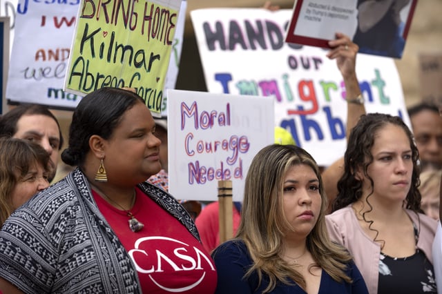 Jennifer Vasquez Sura, center, the wife of Kilmar Abrego Garcia, joins supporters of Abrego Garcia as they rally outside of the U.S. District Court in Greenbelt, Md., where a hearing was scheduled to be held on returning him to Maryland, Monday, July 7, 2025. (AP Photo/Mark Schiefelbein)
