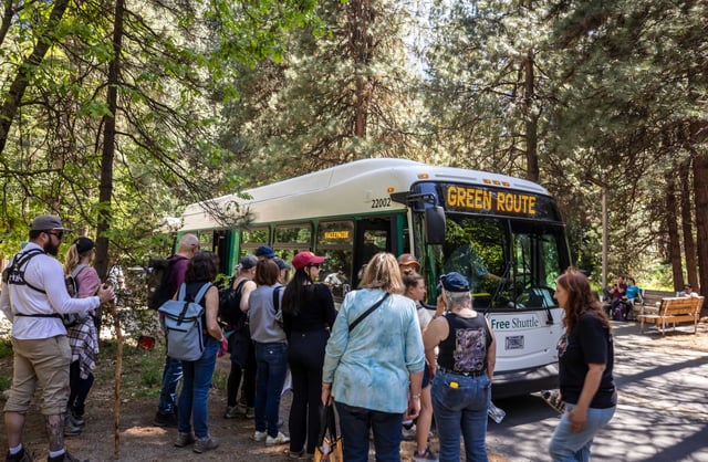 Visitors board buses in Yosemite National Park on May 20, 2025. Visiting California’s national parks — including Yosemite, Muir Woods and Lassen Volcanic — is about to get more expensive for international tourists, following a sweeping executive order signed by President Donald Trump last week.