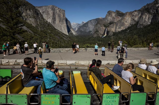 Visitors in a Valley Floor Tours tram make their way past Tunnel View taking in the scenery in Yosemite National Park on May 20, 2025. Visiting California’s national parks — including Yosemite, Muir Woods and Lassen Volcanic — is about to get more expensive for international tourists, following a sweeping executive order signed by President Donald Trump last week.