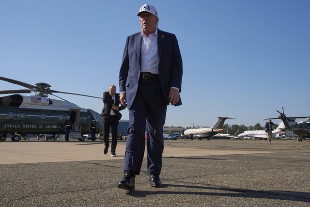 President Donald Trump walks toward the media to speak with them before boarding Air Force One, at Morristown Municipal Airport in Morristown, N.J., Sunday, July 6, 2025, en route to Washington after a weekend in New Jersey. (AP Photo/Jacquelyn Martin)
