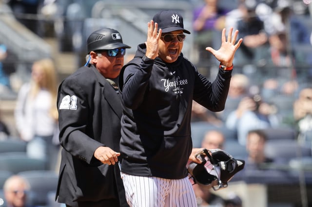 NEW YORK, NEW YORK - APRIL 22: Aaron Boone #17 of the New York Yankees argues with home plate umpire Hunter Wendelstedt #21 in the first inning during the game against the Oakland Athletics at Yankee Stadium on April 22, 2024 in New York City.