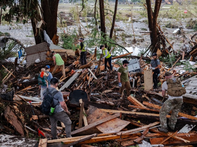 HUNT, TEXAS - JULY 6: Search and rescue workers dig through debris looking for any survivors or remains of people swept up in the flash flooding on July 6, 2025 in Hunt, Texas. Heavy rainfall caused flooding along the Guadalupe River in central Texas with multiple fatalities reported. (Photo by Jim Vondruska/Getty Images)