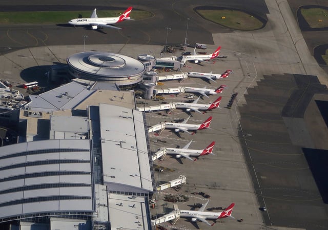 Qantas Airways planes are parked at the domestic terminal at Sydney airport in Australia, July 1, 2017. Picture taken July 1, 2017.  REUTERS/David Gray/File Photo