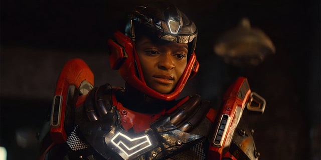 Riri Williams with her helmet up in Ironheart.