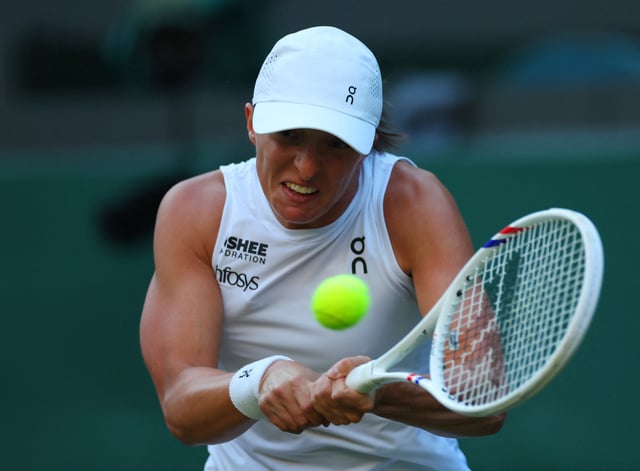 Tennis - Wimbledon - All England Lawn Tennis and Croquet Club, London, Britain - July 7, 2025 Poland's Iga Swiatek in action during her round of 16 match against Denmark's Clara Tauson REUTERS/Isabel Infantes