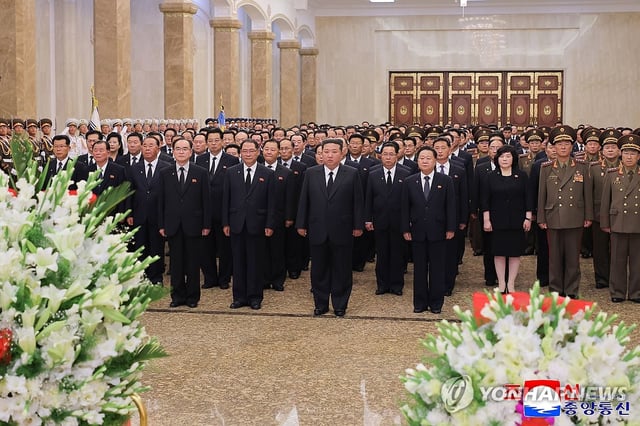 This photo, carried by North Korea's official Korean Central News Agency on July 8, 2025, shows the North's leader Kim Jong-un (C) visiting the Kumsusan Palace of the Sun to pay tribute to late state founder Kim Il-sung to mark the 31st anniversary of his death. (For Use Only in the Republic of Korea. No Redistribution) (Yonhap)