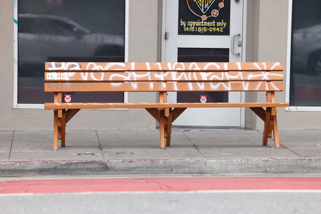 A San Francisco Bay Area Bench Collective bench marked by graffiti prompts questions of who maintains the structures left by the guerrilla group.
