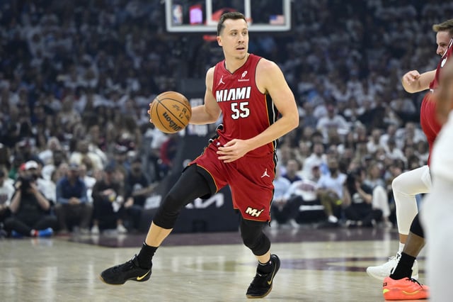 Apr 20, 2025; Cleveland, Ohio, USA; Miami Heat forward Duncan Robinson (55) dribbles the ball in the first quarter against the Cleveland Cavaliers at Rocket Arena. Mandatory Credit: David Richard-Imagn Images/File Photo