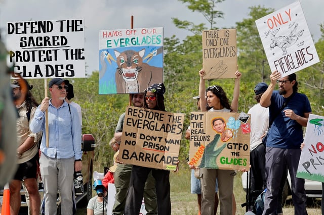 Environmental advocates and protesters at the Dade-Collier Training and Transition Airport on Tamiami Trail E, Ochopee, on Saturday, June 28, 2025, object to the “Alligator Alcatraz” being built at the facility. (Mike Stocker/South Florida Sun Sentinel)