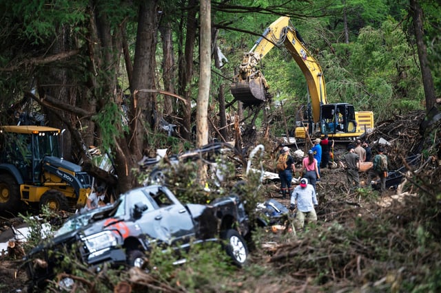 First responders carry out search and rescue operations near the Guadalupe River after a flash flood swept through the area, Monday, July 7, 2025, in Ingram, Texas. (AP Photo/Eli Hartman)