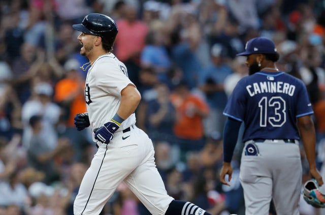 Detroit Tigers&#39; Zach McKinstry, left, rounds the bases past Tampa Bay Rays third baseman Junior Caminero (13) after hitting a home run during the seventh inning of a baseball game Monday, July 7, 2025, in Detroit. (AP Photo/Duane Burleson)