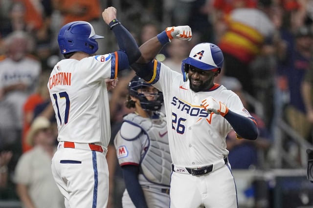 Houston Astros&#39; Taylor Trammell (26) celebrates with Victor Caratini (17) after both scored on Trammell&#39;s three-run home run against the Cleveland Guardians during the fifth inning of a baseball game Monday, July 7, 2025, in Houston. (AP Photo/David J. Phillip)