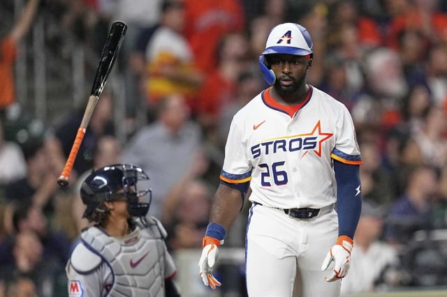 Houston Astros&#39; Taylor Trammell (26) flips his bat after hitting a three-run home run against the Cleveland Guardians during the fifth inning of a baseball game Monday, July 7, 2025, in Houston. (AP Photo/David J. Phillip)
