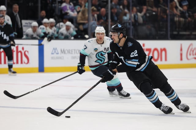Apr 8, 2025; Salt Lake City, Utah, USA; Utah Hockey Club center Jack McBain (22) skates with the puck against the Seattle Kraken during the third period at Delta Center. Mandatory Credit: Rob Gray-Imagn Images/File Photo