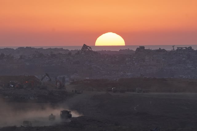 Israeli army vehicles moves in the Gaza Strip as seen from southern Israel on Sunday, July 6, 2025. (Photo/Ohad Zwigenberg)