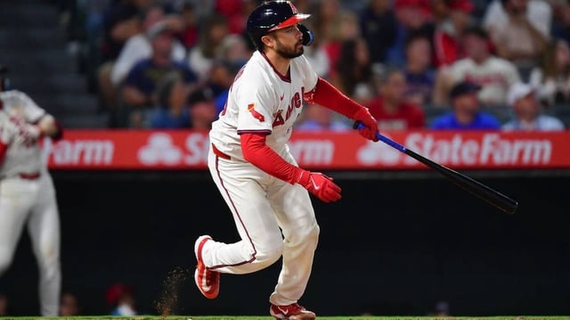 Jul 7, 2025; Anaheim, California, USA; Los Angeles Angels catcher Travis d'Arnaud (25) hits an RBI double against the Texas Rangers during the sixth inning at Angel Stadium. Mandatory Credit: Gary A. Vasquez-Imagn Images