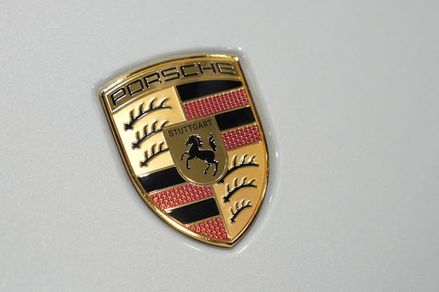 Porsche logo is pictured at the Everything Electric, the Home Energy & Electric Vehicle Show, in London, Britain, April 16, 2025. REUTERS/Maja Smiejkowska/File Photo