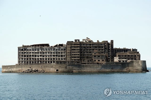 This photo taken July 7, 2025, from a ship shows Hashima Island, also known as Battleship Island, where many Koreans were forced into hard labor during World War II. (Yonhap)