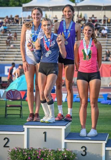 Jurupa Valley’s AB Hernandez, second from left, shares the first-place podium spot with Jillene Wetteland, left, of Poly Long Beach and Lelani Laruelle of Monta Vista in a three-way tie during a medal ceremony for the high jump at the California high school track-and-field championships in Clovis, California, on May 31, 2025. (CRAIG KOHLRUSS/The Fresno Bee/TNS)
