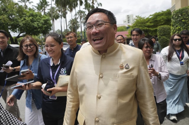 Thailand Deputy Finance Minister Julapun Amornvivat leaves Government House in Bangkok, Thailand, Tuesday, July 8, 2025. (AP Photo/Sakchai Lalit)