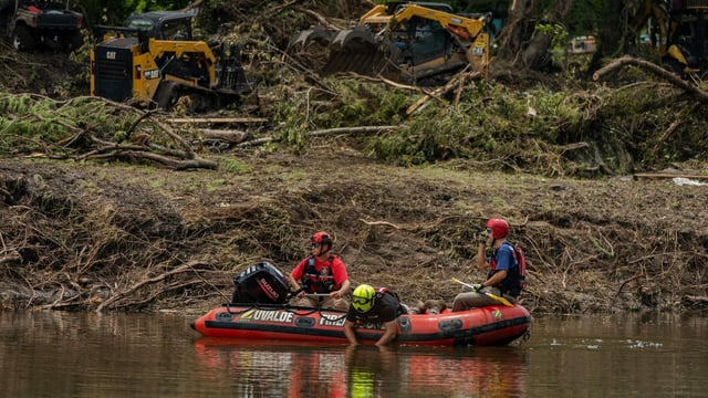 HUNT, TEXAS - JULY 7: Search and rescue workers use a sonar device while paddling down the Guadalupe River in a boat looking for survivors or the remains of victims swept up in the flash flooding on July 7, 2025 in Hunt, Texas. 