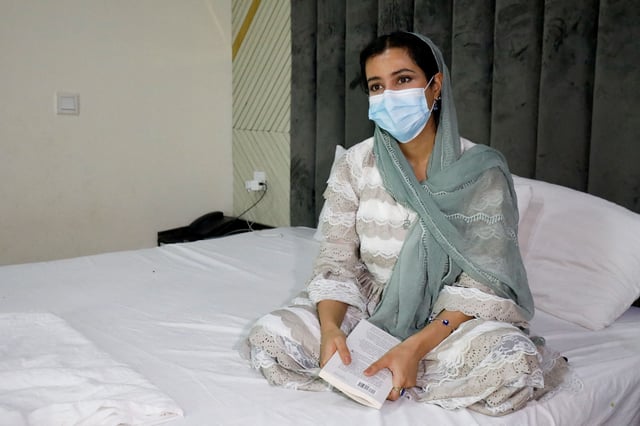 Kimia, 25, an Afghan journalist and artist who was accepted into Germany's humanitarian admission program for vulnerable Afghans, now stranded in legal limbo, speaks with Reuters at a guest house where she is living, in Islamabad, Pakistan June 13, 2025. REUTERS/Salahuddin/File Photo