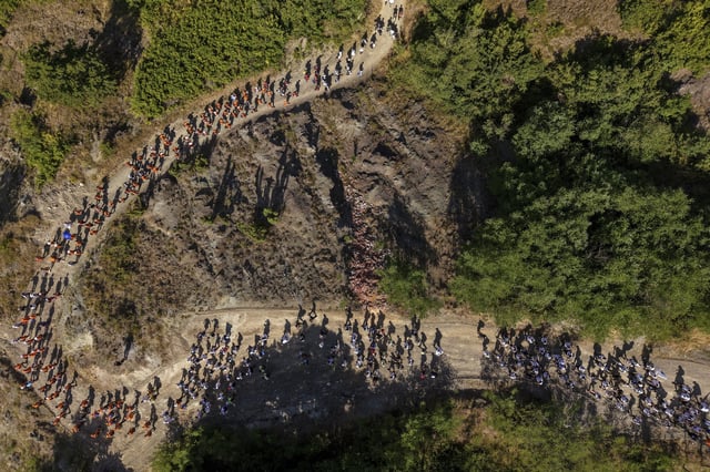 People participate in the "March of Peace" to remember the 1995 Srebrenica genocide, in Nezuk, Bosnia, Tuesday, July 8, 2025. (AP Photo/Armin Durgut)