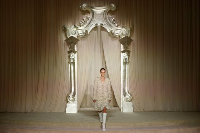 A model presents a creation by the creative studio of fashion house Chanel as part of their Haute Couture Fall/Winter 2025-2026 collection show in Paris, France, July 8, 2025. REUTERS/Manon Cruz