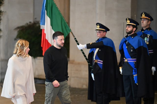 Ukrainian President Volodymyr Zelensky (C) will open the annual conference with Italian Prime Minister Giorgia Meloni (L)