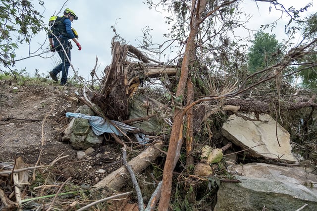First responders from College Station Fire Department search along the banks of the Guadalupe River, as rescue efforts continue following extreme flooding, Sunday, July 6, 2025, in Ingram, Texas. (AP Photo/Rodolfo Gonzalez)