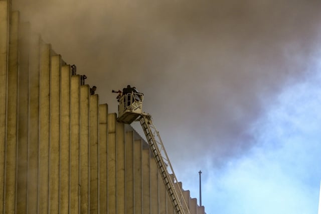 Firefighters douse the flames after a fire broke out in a key telecomms hub in the Egyptian capital