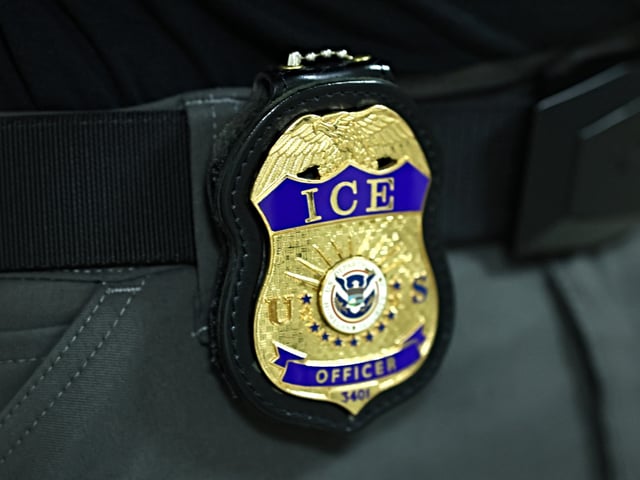 NEW YORK, NEW YORK - JUNE 09: The badge of an Immigration and Customs Enforcement (ICE) agent is seen as they patrol the halls of immigration court at the Jacob K. Javitz Federal Building on June 09, 2025 in New York City. Federal agents are arresting immigrants during mandatory check-ins, as ICE ramps up enforcement following immigration court hearings. The Trump administration has ordered officials to increase detentions to 3,000 migrants per day. (Photo by Michael M. Santiago/Getty Images)